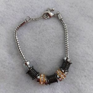 Lia Sophia 3 tone charm bracelet